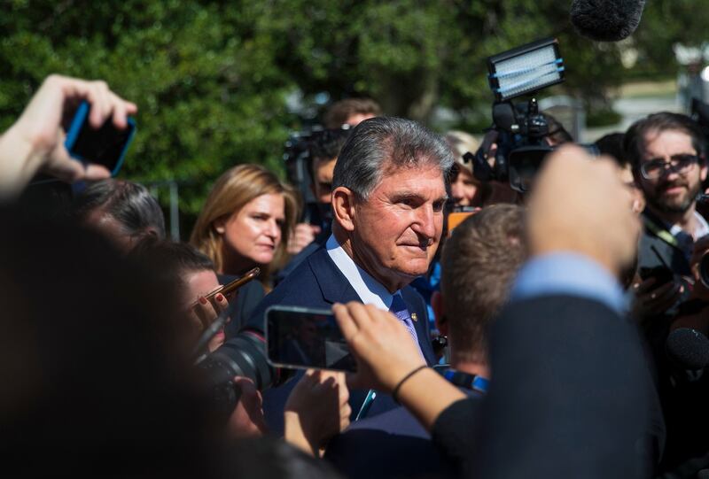 Sen Joe Manchin speaks with reporters outside the Capitol in Washington DC on Thursday. Photograph: Tom Brenner/The New York Times