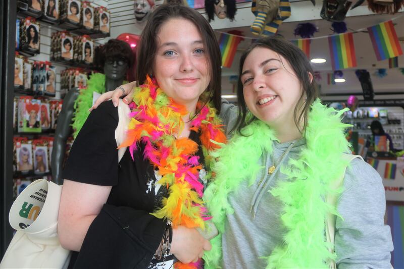 Fans Caoimhe Ní Chiardha (left) and Emma Cody wearing feather boas before Saturday's concert at Slane Castle.