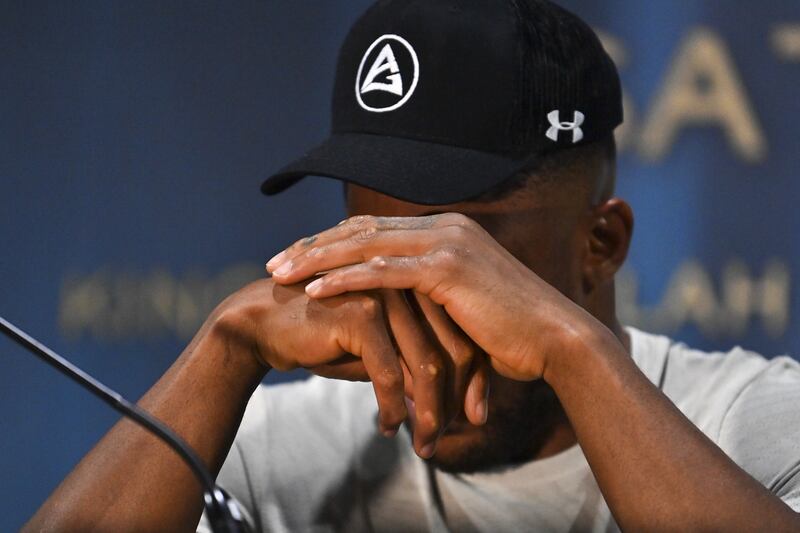 Anthony Joshua wipes away tears during his press conference after losing to Ukraine's Oleksandr Usyk. Photograph: EPA