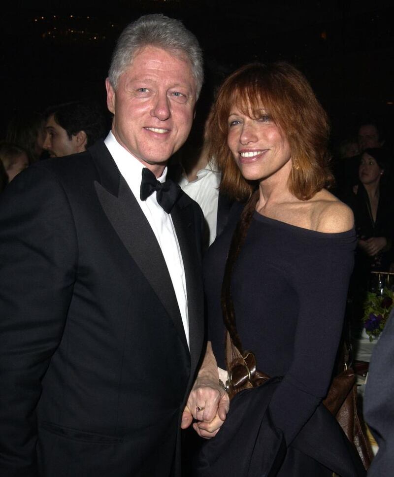 Carly Simon with Bill Clinton in 2003: ‘He has ‘the glint’, and he can’t help himself.’ Photograph: Steve Granitz/WireImage/Getty