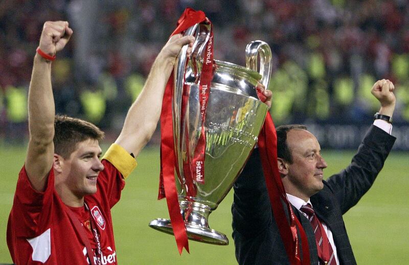 Liverpool captain Steven Gerrard lifts the Champions League trophy with manager Rafael Benítez in Istanbul in 2005. File photograph: Mustafa Ozer/AFP/Getty Images