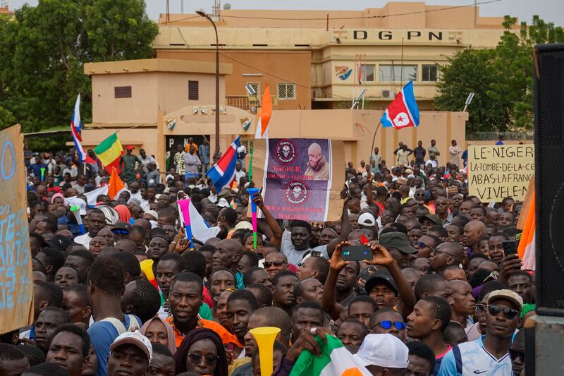 Supporters of the military junta display a photo of Yevgeny Prigozhin, head of the Wagner Group, during a protest against a potential military intervention in Niamey, in August. Photograph: Issifou Djibo/EPA