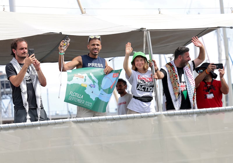 Swedish climate activist Greta Thunberg and activists wave as their boat, part of a civilian flotilla aiming at breaking the Israeli blockade of the Gaza Strip leaves the port of Barcelona, on August 31st Photograph: AFP via Getty Images