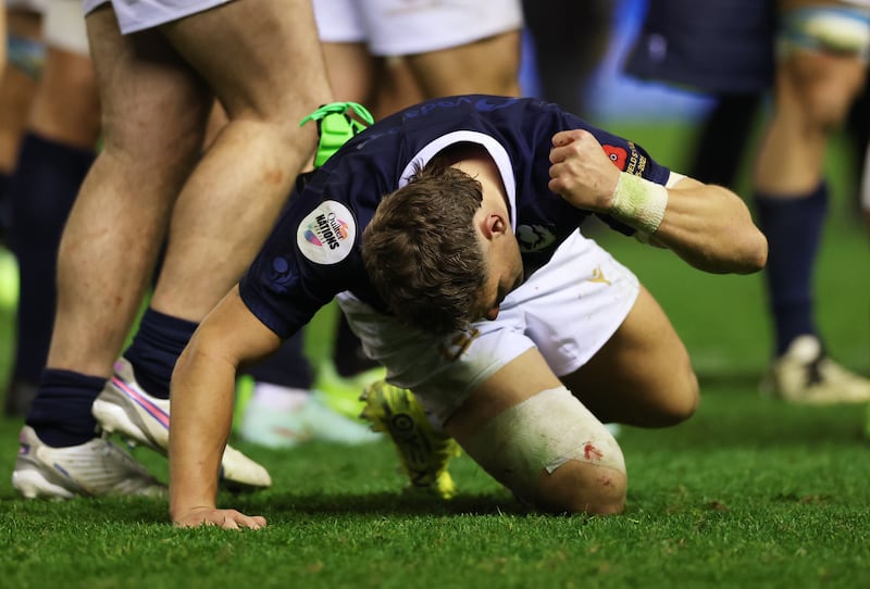 Darcy Graham of Scotland punches the pitch after his team's defeat. Photograph: Stu Forster/Getty