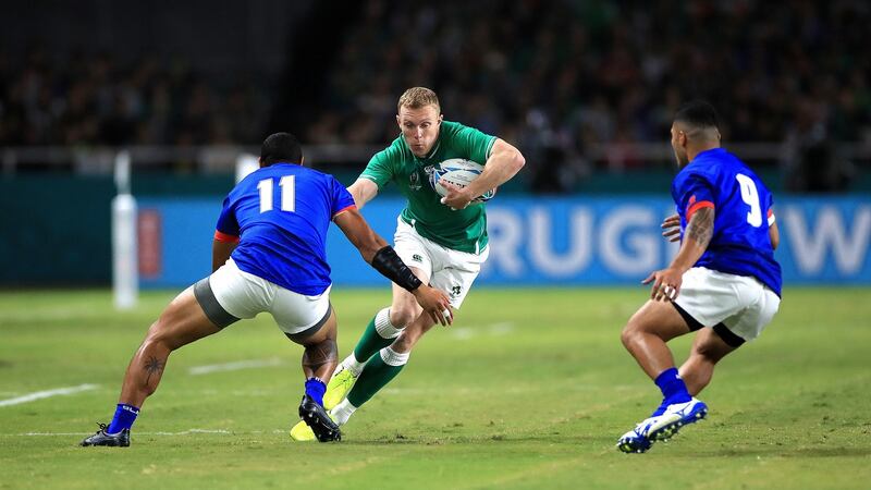 Ireland winger  Keith Earls  runs at  Samoa’s Ed Fidow and Dwayne Polataivaia  during the  Rugby World Cup Pool A match at  the Hakatanomori stadium in Fukuoka. Photograph:  Adam Davy/PA Wire