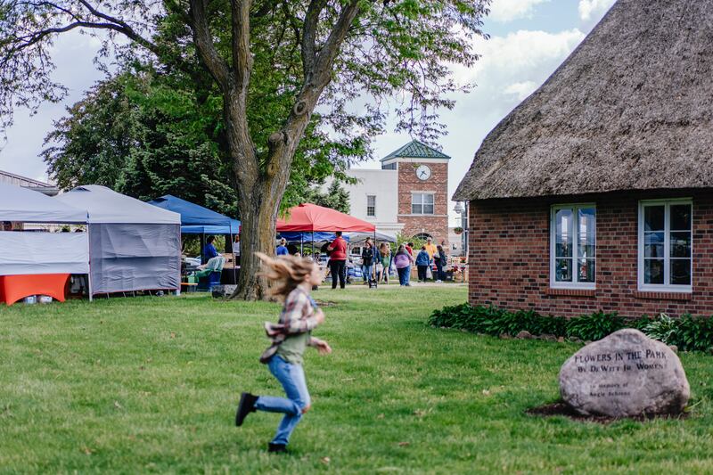 DeWitt's weekly farmers market. 'We are forcing people to either become illegal or to become a burden on the community ... and it makes absolutely no sense,' says Angela Boelens. Photograph: Jamie Kelter Davis/The New York Times