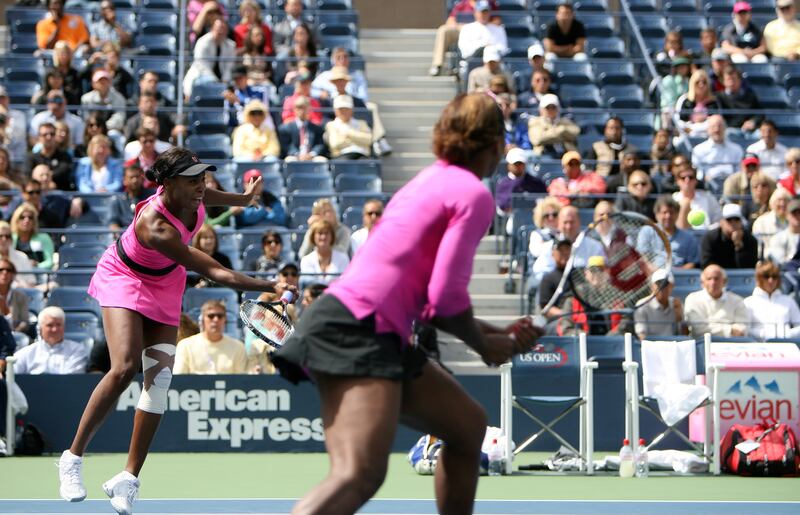 Serena, foreground, and Venus Williams during a doubles match against Ekaterina Makarova and Alisa Kleybanova of Russia at the US Open 2009. Photograph: Raymond McCrea Jones/The New York Times