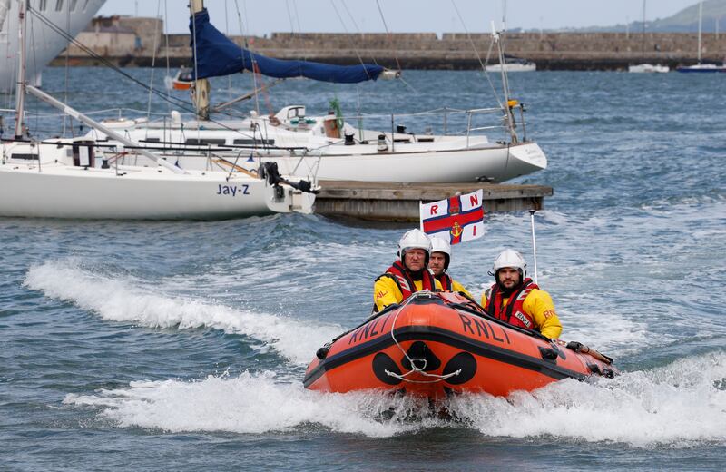 RNLI team in their vessel for a practice run in Dún Laoghaire harbour.    Photograph: Nick Bradshaw/The Irish Times