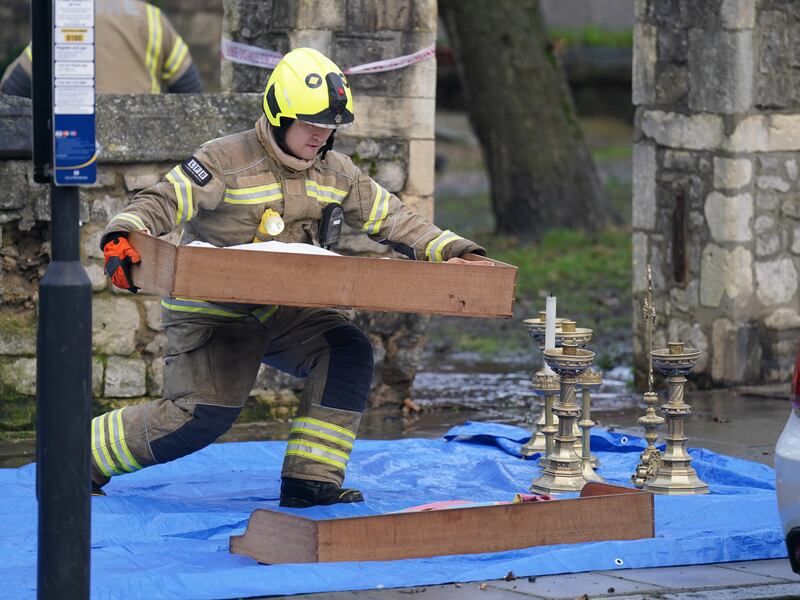Firefighters remove items from St Mark's Church. Photograph: James Manning/PA