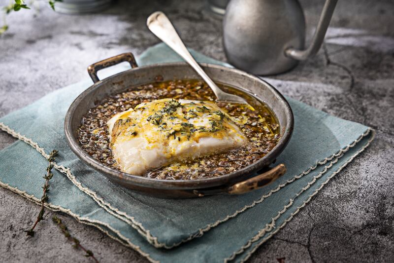 Baked hake with lentils, English mustard, garlic and thyme butter. Photograph: Harry Weir Photography