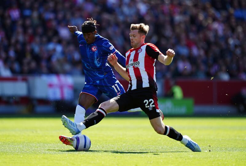 Chelsea's Noni Madueke and Brentford's Nathan Collins (right) battle for the ball. Photograph: Zac Goodwin/PA Wire