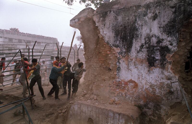 Hindu fundamentalists attack a wall of the 16th century Babri mosque with iron rods during its destruction in December, 1992. Photograph: Douglas E Curran/AFP via Getty Images