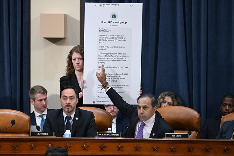 Democratic Representative Raja Krishnamoorthi points to a screenshot of a Signal group chat while questioning witnesses during a hearing on global threats before the House Intelligence Committee in Washington on Wednesday. Photograph: Kenny Holston/The New York Times
                      