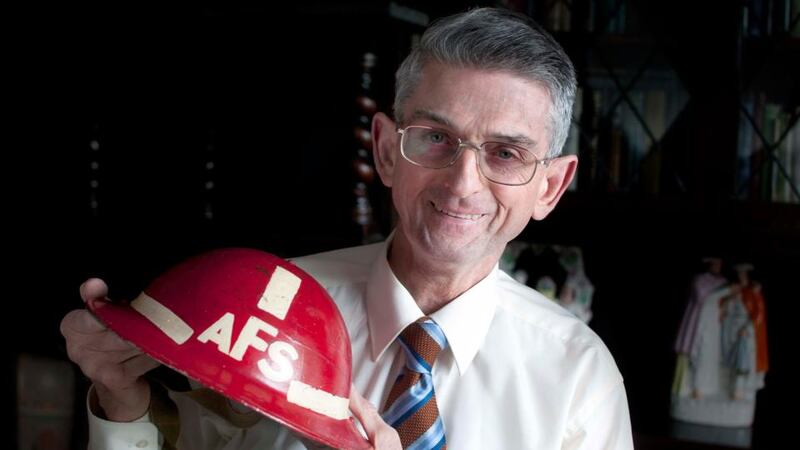 Pat Poland with the ‘Tin Lid’ Auxiliary Fire Service helmet that he wore aged 17 on the day JFK visited Cork. Photograph: Provision / Michael O’Mahony
