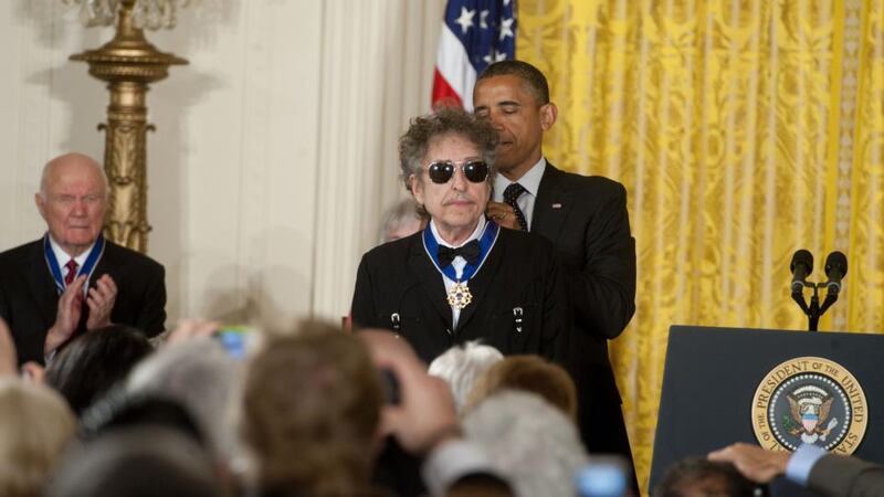 Bob Dylan: the medal from Barack Obama would have seemed distant indeed to the threadbare young heir of Woody Guthrie. Photograph: Leigh Vogel/WireImage/Getty