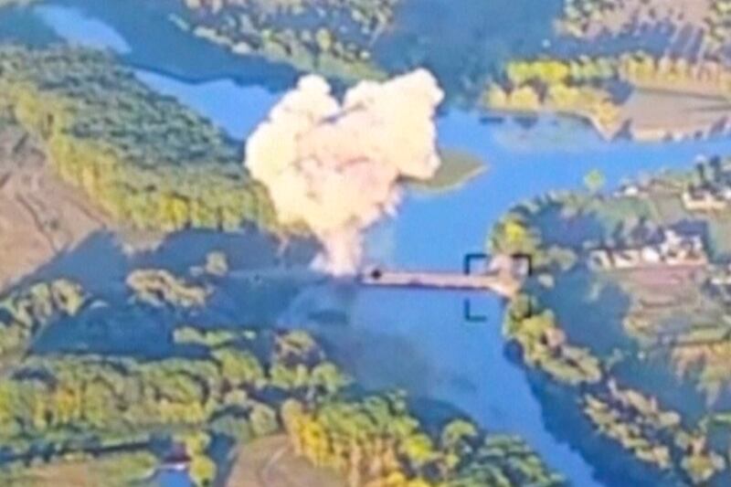 Smoke billows as a key bridge in Russia's Kursk region is destroyed. 
 Photograph: Ukrainian Armed Force via AP