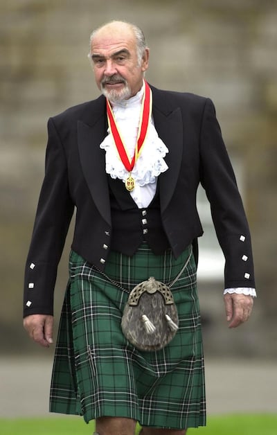 Sir Sean Connery, Wednesday July 5, 2000 in Highland dress and wearing his medal after he was formally knighted by Britain's Queen Elizabeth II during a ceremony in his home city Edinburgh, Scotland. The Scottish screen legend, who was honoured at the Palace of Holyroodhouse in Edinburgh, knelt while the Queen touched his shoulders lightly with a sword and made him a Knight during the ceremony in the Palace's Picture Gallery. (AP Photo/ David Cheskin/WPA pool)