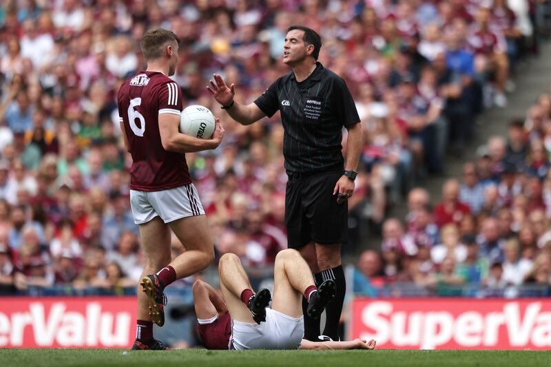 Referee Seán Hurson talks to John Daly of Galway during the 2022 All-Ireland SFC final. Photograph: Bryan Keane/Inpho