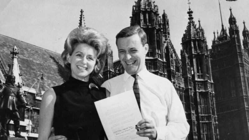 Tony Benn and his wife Caroline outside the Houses of Parliament in 1963. Photograph: Keystone/Getty Images