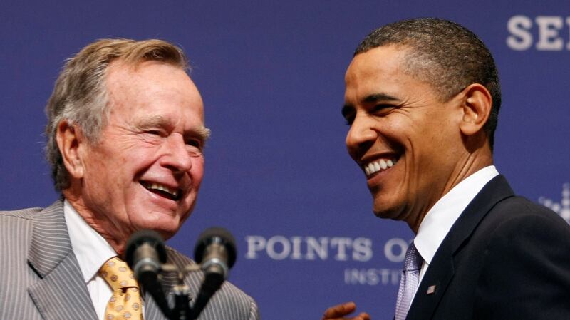 A file image of  former  US president Barack Obama with George HW Bush in 2009. Photograph:  Reuters