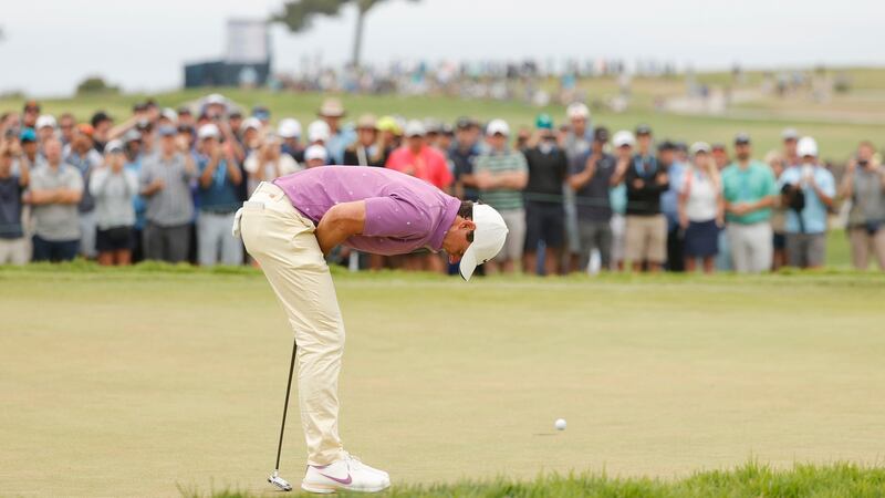 McIlroy reacts to a missed putt on the ninth hole. Photo: Ezra Shaw/Getty Images