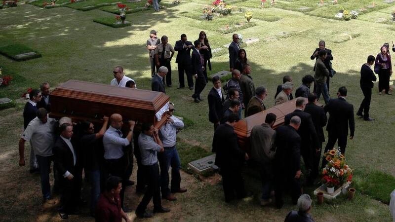 Relatives carry the coffin of  Monica Spear and that of her ex-husband Thomas Henry Berry  during their funeral in Caracas. Photorgraph: Carlos Garcia Rawlins/Reuters
