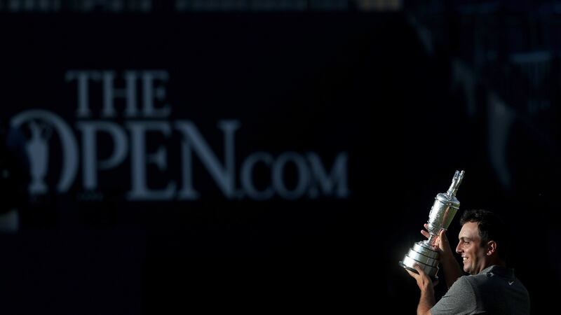 Italy’s Francesco Molinari holds the Claret Jug during the presentation ceremony for the british Open at Carnoustie. Photograph:  David Davies/PA Wire