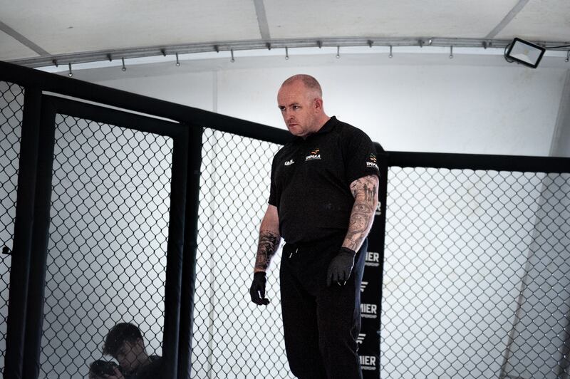 Derek Hickey, Ireland's most experienced referee, oversees the action at Premier MMA in Kilkenny. Photograph: Megan Ponomarenko 