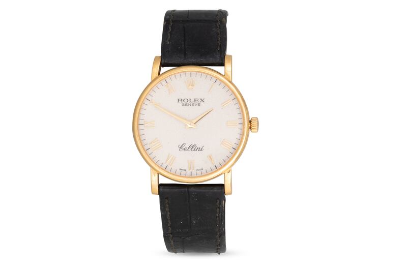 Lady’s Rolex Cellini cream face wristwatch with Roman numerals and an 18ct gold case, clasp and buckle with black leather strap