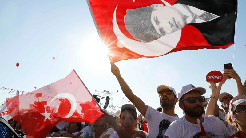 People wave Turkish flags during a rally to mark the end of Republican People’s Party leader Kemal Kiliçdaroglu’s 25-day long protest march, in Istanbul. Photograph: Umit Bektas/Reuters