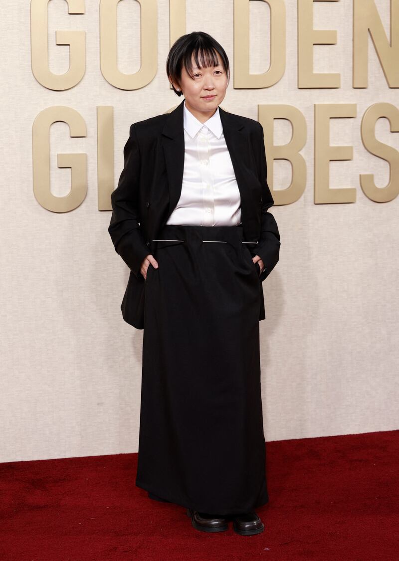 Sticking through the waistband of Celine Song’s Loewe skirt was a two-foot silver needle. Photograph: Michael Tran/AFP