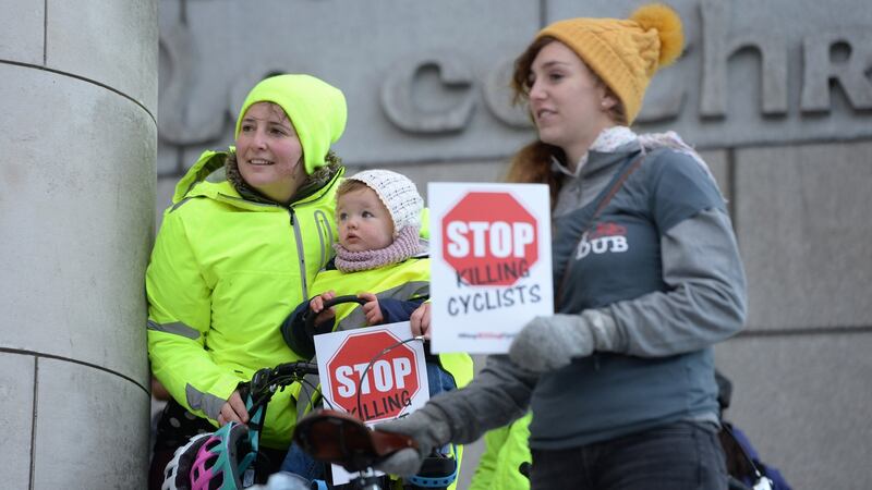 Olga Walsh with baby Matilda, and Helen Wallace (right) joined I Bike Dublin as they staged a ‘die-in’ action at Dublin City Council’s offices. Photograph: Dara Mac Dónaill