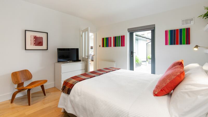 Main bedroom with doors to hall and garden