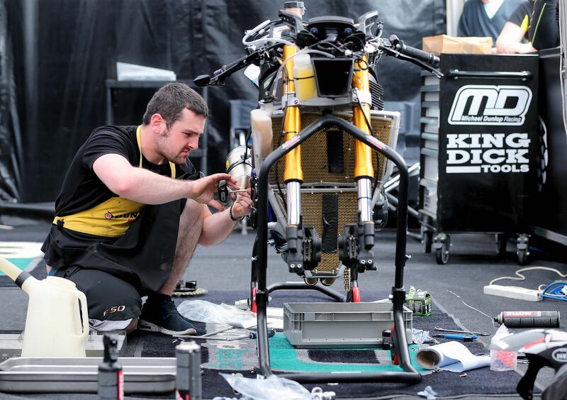 Michael Dunlop working on his Superstock BMW S1000RR at the Isle of Man TT in 2016. Photograph: Stephen Davison