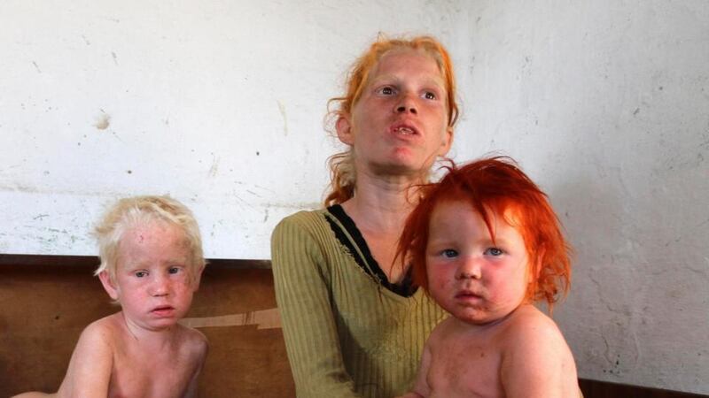 Three of the children of Roma woman Sasha Ruseva pictured inside their home in Nikolaevo, southern Bulgaria. Phootgraph: Reuters