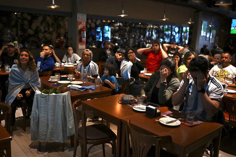 Football fans of Argentina watch the Qatar 2022 World Cup Group C football match between Argentina and Saudi Arabia. Photograph: Luis Robayo/AFP via Getty
