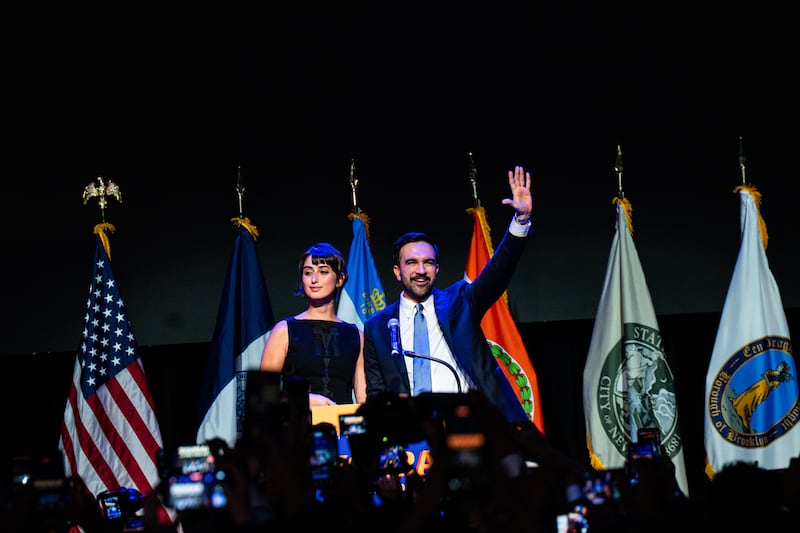 Zohran Mamdani is joined onstage by his wife, Rama Duwaji, at his election night event at the Paramount Theater in Brooklyn, Nov 4, 2025. Photograph: Amir Hamja/The New York Times
                      
