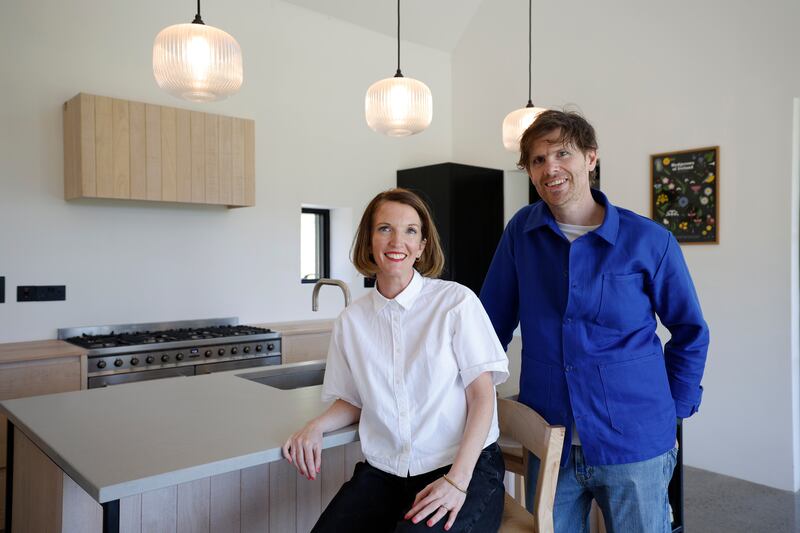 Conor and Nell in their Scandinavian-inspired kitchen.