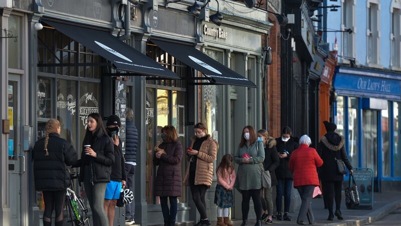 Queuing outside Thyme Out, a gourmet grocery store in Dalkey, Co Dublin. Photograph: Artur Widak/NurPhoto via Getty