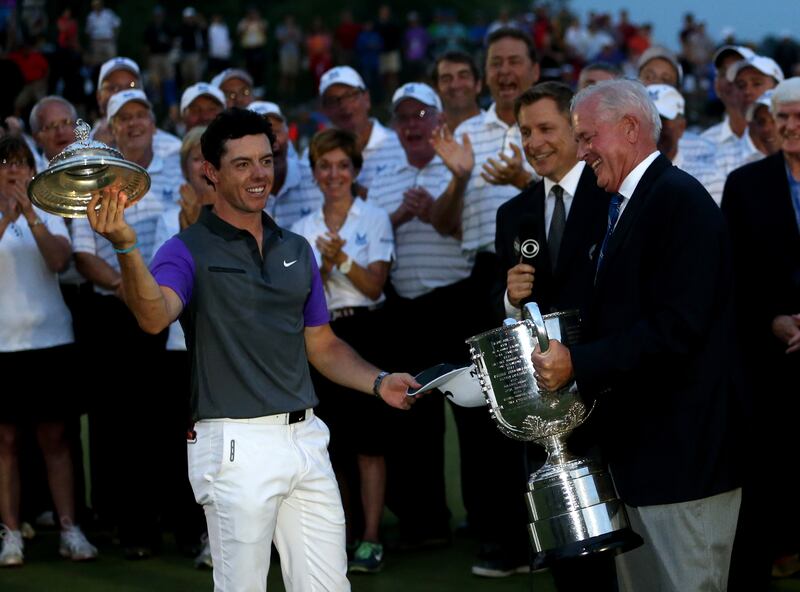 Rory McIlroy holds the lid he caught off the Wanamaker trophy after winning the 2014 US PGA at Valhalla Golf Club in Louisville, Kentucky. Photograph: Andrew Redington/Getty Images