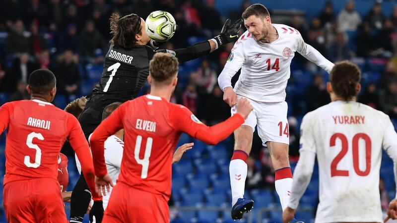 Henrik Dalsgaard leaps to score Denmark’s equaliser in Basel. Photograph: Fabrice Coffrini/AFP/Getty
