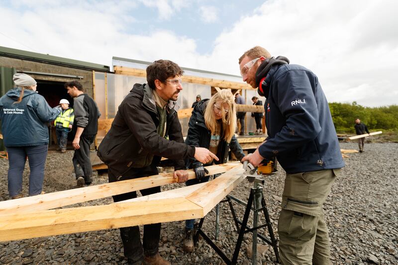 Working on roof truss contruction at Common Knowledge. Photograph: Eamon Ward