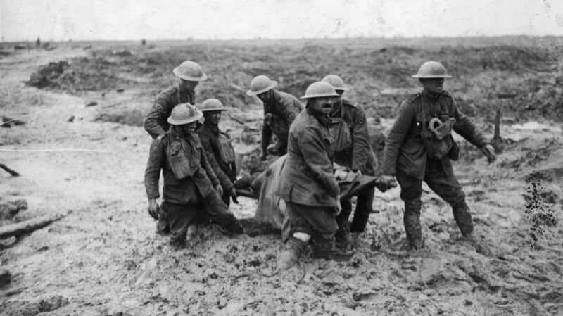 A stretcher-bearing party carrying a wounded soldier through the mud near Boesinghe during the battle of Passchendaele in Flanders. Photograph: John Warwick Brooke/Getty Images