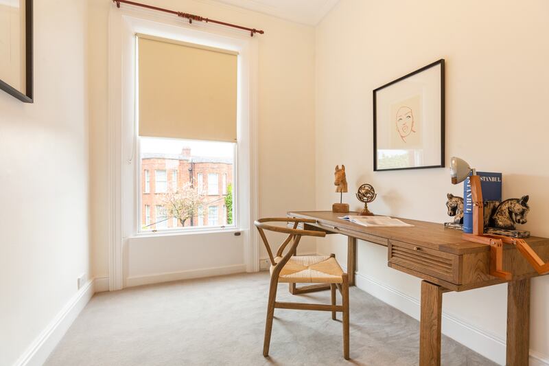 Bedroom four is laid out as a study