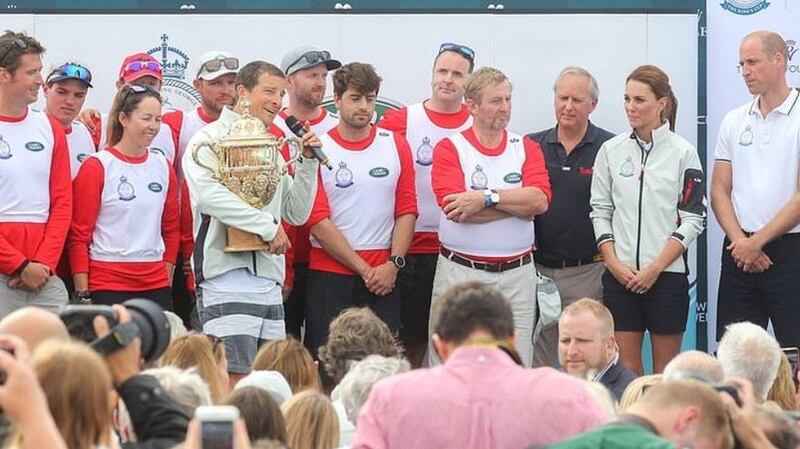 Bear Grylls (centre) holds The King’s Cup after his crew’s winning perofrmance at a royal regatta on Thursday, alongside former taoiseach Enda Kenny. Photograph: Tusk/Twitter
