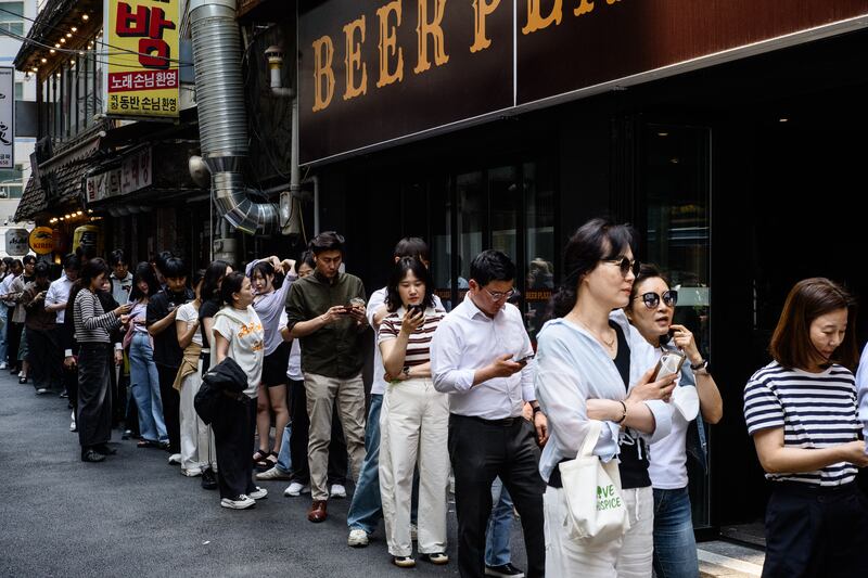 Voters in Seoul queue to cast their ballots on Friday during early voting in the presidential election. Photograph: Anthony Wallace/Getty