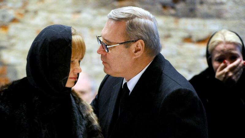 Opposition activist and former Russian prime minister Mikhail Kasyanov  comforts a relative during a farewell ceremony to the slain opposition leader Boris Nemtsov in Moscow today. Photograph:  Olga Maltseva/AFP/Getty Images