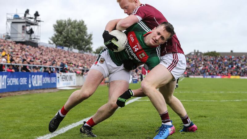 Galway’s Declan Kyne tackles Cillian O’Connor. Mayo would have been better advised to try and get their chief score-getter on the ball in the final decisive moments at Salthill. Photograph: Cathal Noonan/Inpho