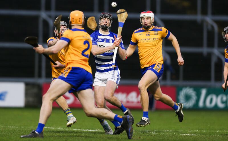 Na Fianna defenders move in to close down Naas' Kevin Aherne during the Leinster SHC club semi-final at O'Moore Park on Saturday. Photograph: Tom Maher