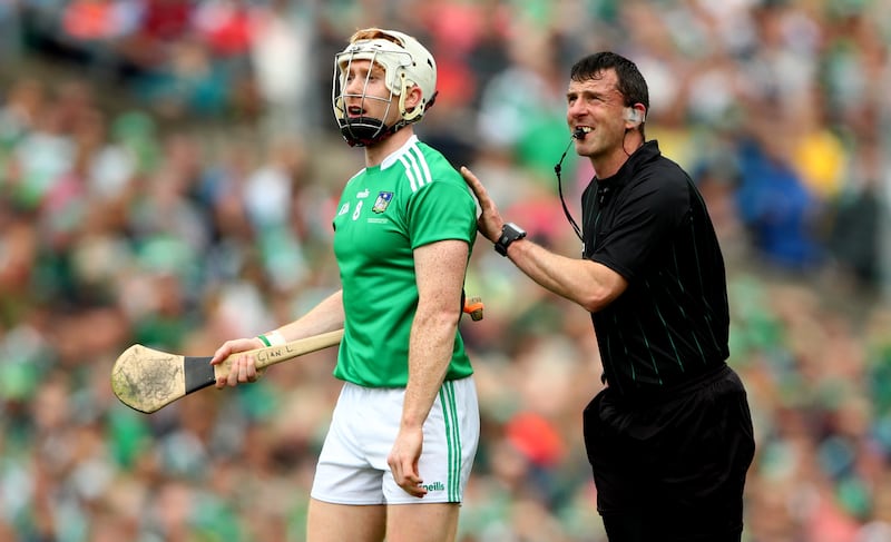 Paud O'Dwyer, in his refereeing days, with Limerick's Cian Lynch during the Munster GAA Senior Hurling Championship Final between Tipperary and Limerick. Photograph: James Crombie/Inpho